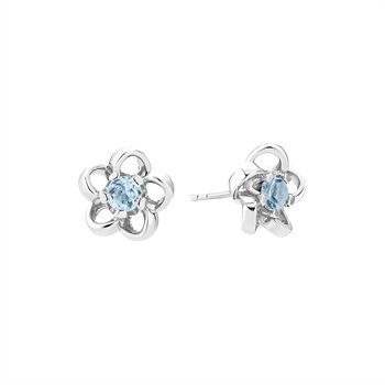 Flower-shaped sterling silver earrings with central blue topaz gemstone and post-back design.