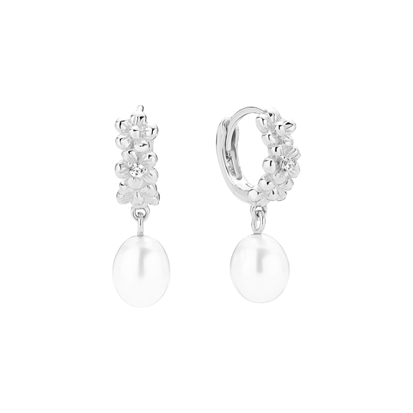 Sterling silver hoops with flower motifs, zirconia centers, and dangling oval freshwater pearls.