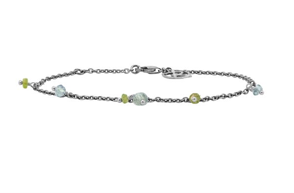Silver bracelet with colorful beads, lobster clasp, and circular charm near clasp.