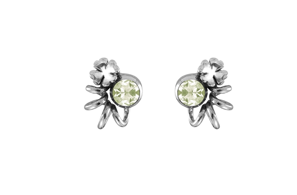 Earrings with light green gemstones, surrounded by metallic floral-like embellishments.