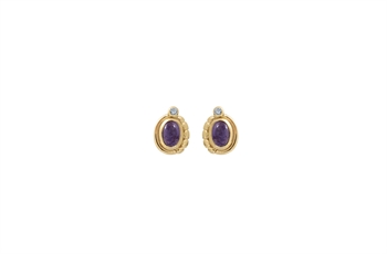 Gold earrings with oval purple stone and small clear stone on top, set in a gold-colored setting.