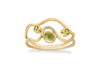 Gold ring with wavy, open bands and three green stones; largest centered, smaller stones flanking.