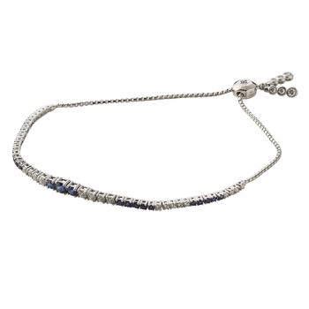 Tennis bracelet with blue sapphire and diamonds