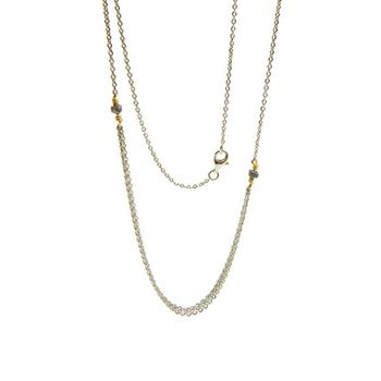 Elegant multi-strand necklace in silver, gold, with dark stones and split chain design.