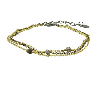 Gold and dark multi-strand bracelet with raw stones and adjustable clasp.