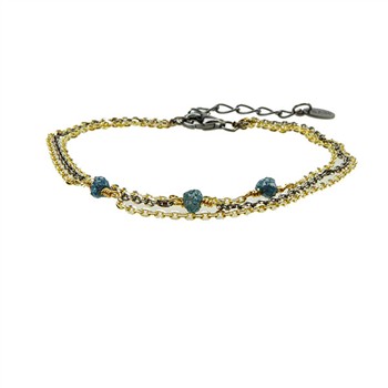 Three-strand bracelet with gold and dark chains, blue-green diamonds, and a dark extension chain.