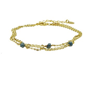 Gold triple-strand bracelet with blue-green stones and an extension chain with a round tag.