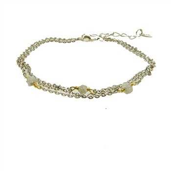 Three-row silver bracelet with gold connectors, rough stones, and adjustable extension chain.