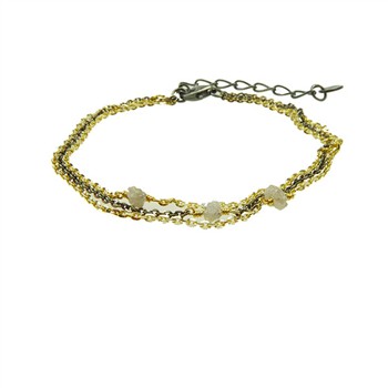 Three-strand gold and black bracelet with grey raw diamonds and adjustable clasp.