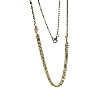 Gold and dark chain necklace with two rough stones and a triple-strand center design.