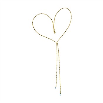 Delicate gold chain in heart shape with two strands, blue ends, and textured surface.