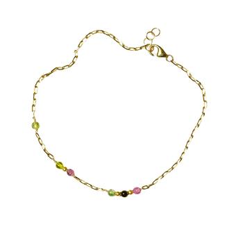 Gold bracelet with pink, yellow/green beads, clasp closure, and extension chain for adjustability.