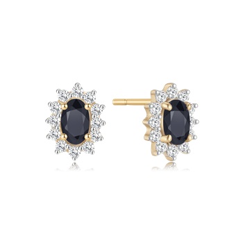 Gold earrings with central dark oval stone, clear halo stones, and post backing from Støvring Design.