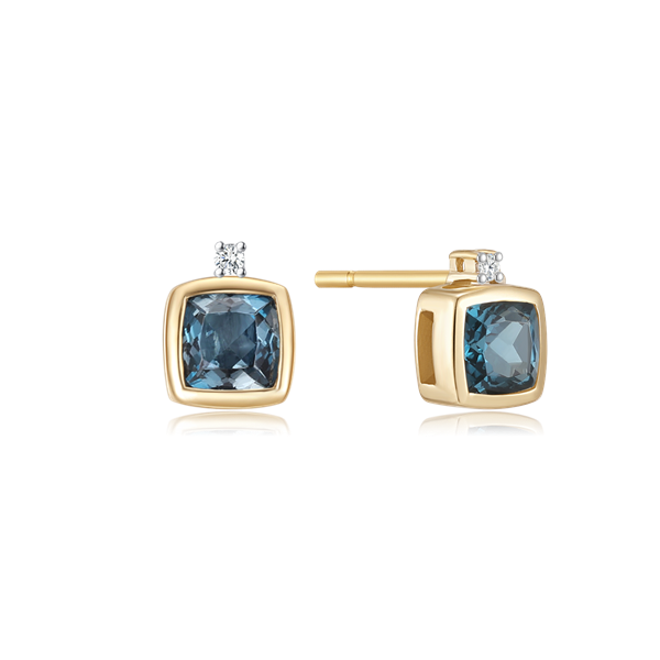 Gold stud earrings with square blue gemstones and small clear stones, featuring a visible securing post.