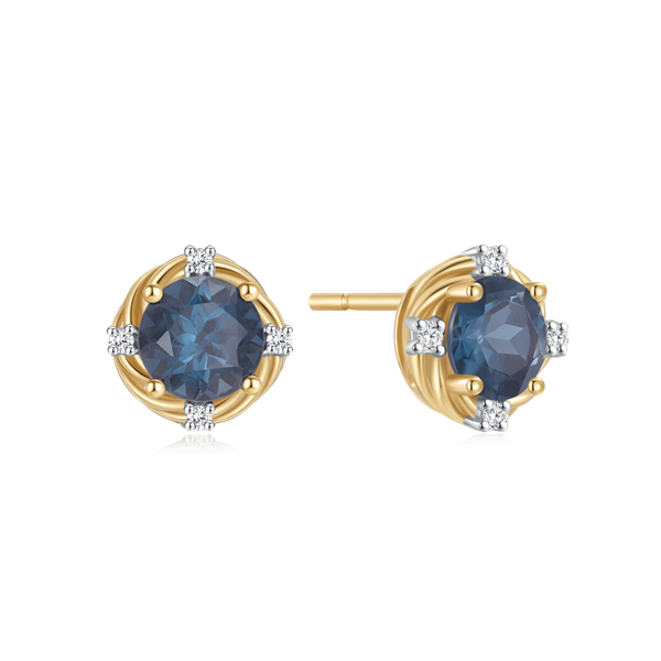 Gold earrings with a round blue gemstone, accented by four small clear stones in a gold setting.