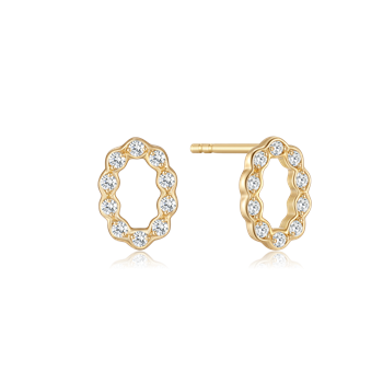 Gold oval earrings with scalloped edges, each featuring a small clear stone.
