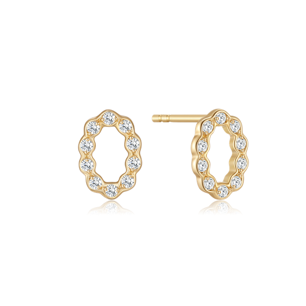 Gold oval earrings with scalloped edges, each featuring a small clear stone.