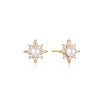 Star-shaped gold earrings with central pearl and diamond-like stones from Støvring Design.