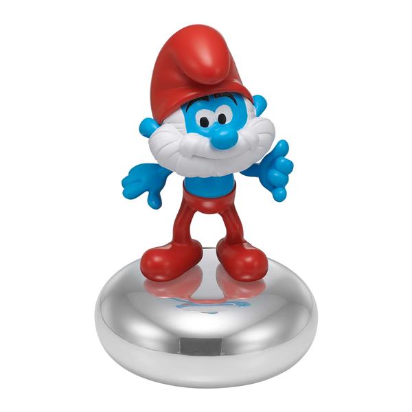 Smurf figure with blue body, white beard, red hat and pants on a shiny base with a coin slot.