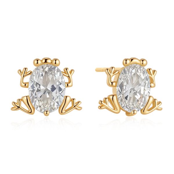 Gold-colored frog-shaped earrings with detailed limbs and an oval clear gemstone at the center.