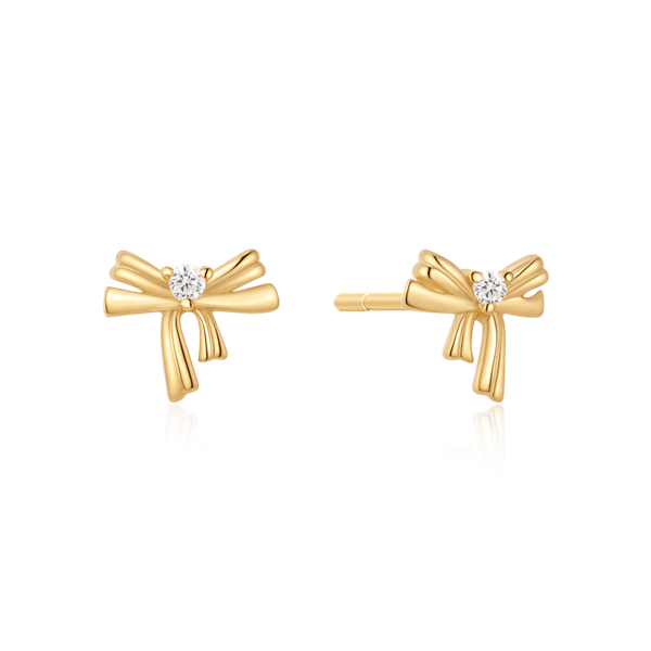 Gold bow-shaped earrings with center gemstone from Støvring Design.