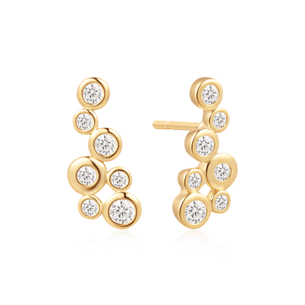 Gold-toned earrings with vertical circular elements, each with a diamond-like central stone.