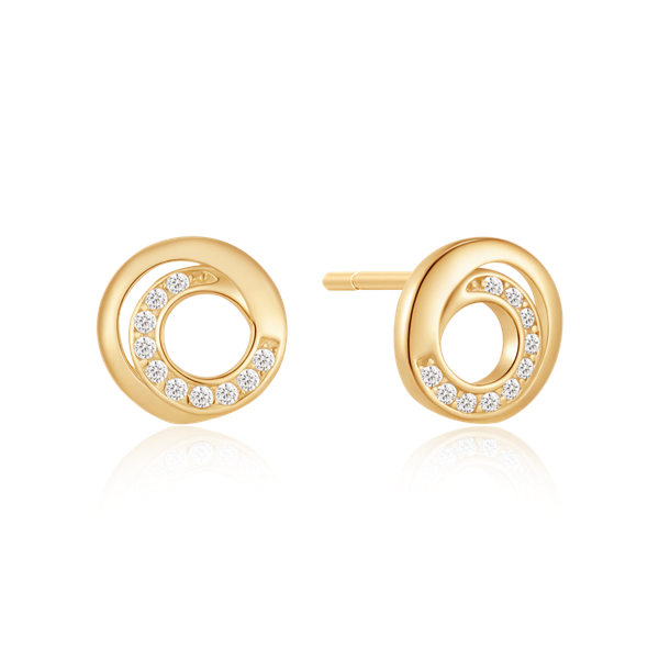 Gold circular stud earrings with embedded clear stones, reflecting light on a black background.