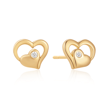 Heart-shaped silver-gilded earrings with a central clear stone and a polished, reflective finish.