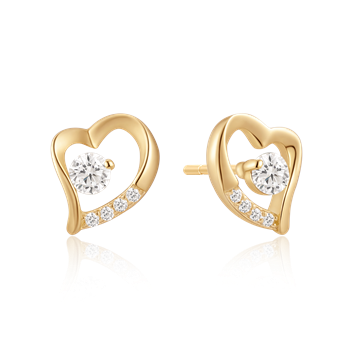 Gold heart earrings with central gemstone and smaller stones on one side.