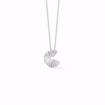 Silver spiral pendant with textured design on a delicate chain necklace.