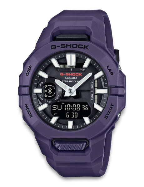 Purple Casio G-Shock watch with analog-digital display, labeled buttons, and Bluetooth symbol.