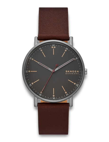 Black watch with brown nubuck leather strap and dial displaying "SKAGEN DENMARK". Minimalist design.