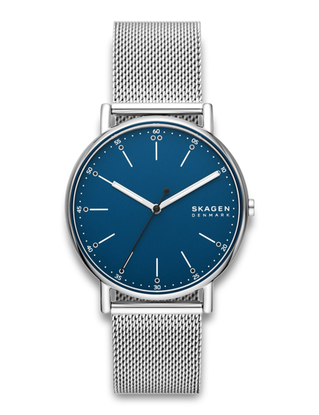 Blue dial with white markings, silver mesh strap, Skagen branding visible.