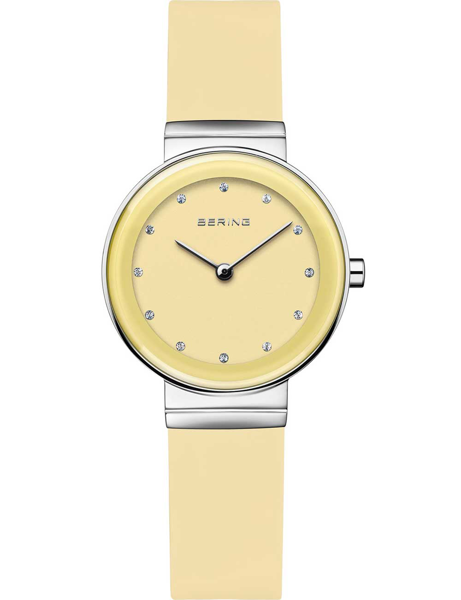 Light yellow Bering ladies watch with crystal hour markers, matching strap, and silver-tone accents.