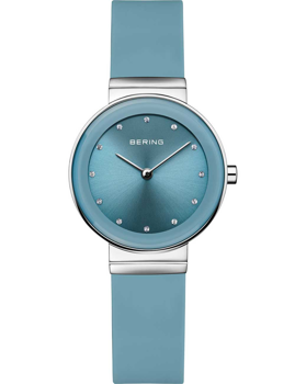 Round blue dial, dot markers, blue strap, minimalist design, two silver hands, elegant ladies watch.