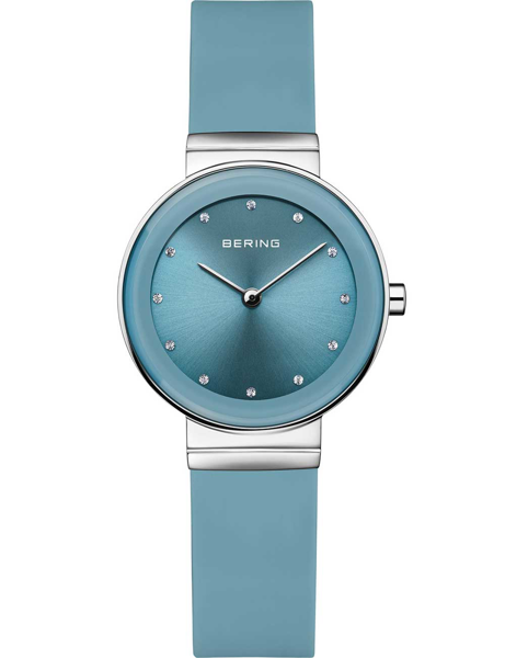 Round blue dial, dot markers, blue strap, minimalist design, two silver hands, elegant ladies watch.