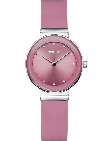 Pink Bering watch with stone markers, matching strap, minimalist design, and brand name on dial.