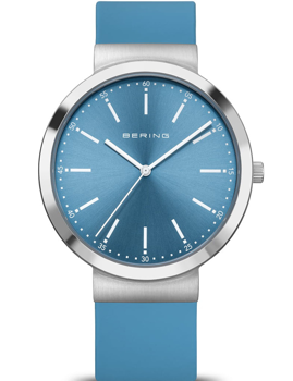 Blue-dial watch with silver bezel, minimalist markers, and matching blue strap. Elegant design.