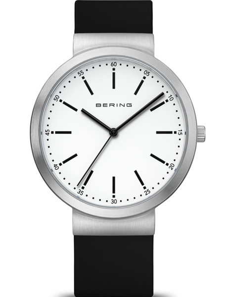 Round silver case, white dial, black markers and hands, black strap, minimalist design.