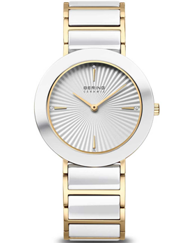 Bering watch with gold-white link bracelet, sunburst dial, minimal markers, and "BERING CERAMIC" branding.