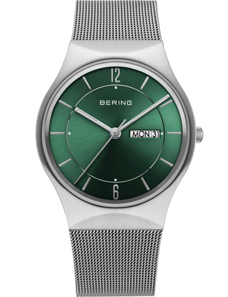 Green dial watch with day-date display, minimalist design, and mesh strap.