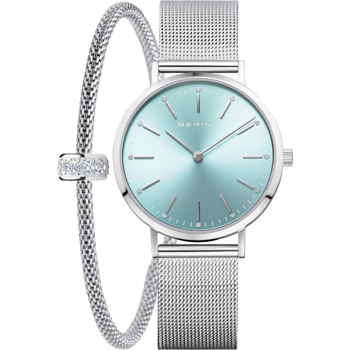 Light blue dial watch with metal mesh strap, paired with a matching bracelet featuring stones.