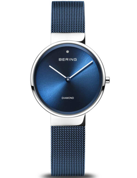Minimalist blue Bering watch with mesh strap, branding on dial, sleek design, and silver accents.