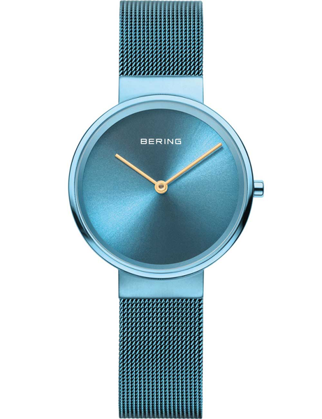 Bering ladies\' watch with blue round face, golden hands, and a blue mesh strap.