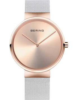 Circular rose gold watch with minimalist design, "BERING" on face, and a silver mesh band.