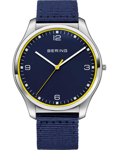 Bering men\'s watch with blue dial, white numerals, yellow second hand, and blue fabric strap.