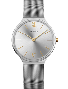 Silver Bering ladies watch with gold markers, logo on dial, and a mesh band. Ultra-slim design.