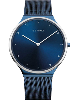 Ultra-slim Bering men's watch with blue dial, minimalist markers, mesh strap, and brand name on dial.