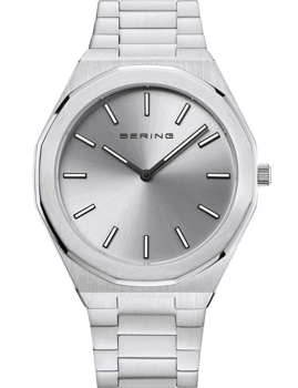 Round silver watch with minimalist hour markers, BERING branding, and brushed metal bracelet.