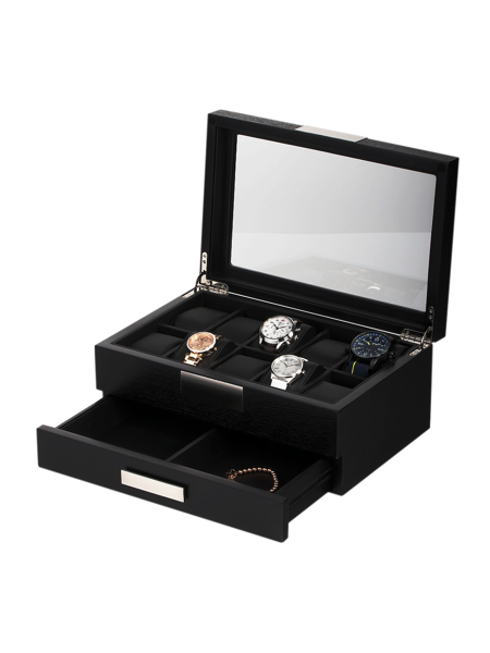 Black watch box with glass lid, four watches inside, open drawer below for additional storage.